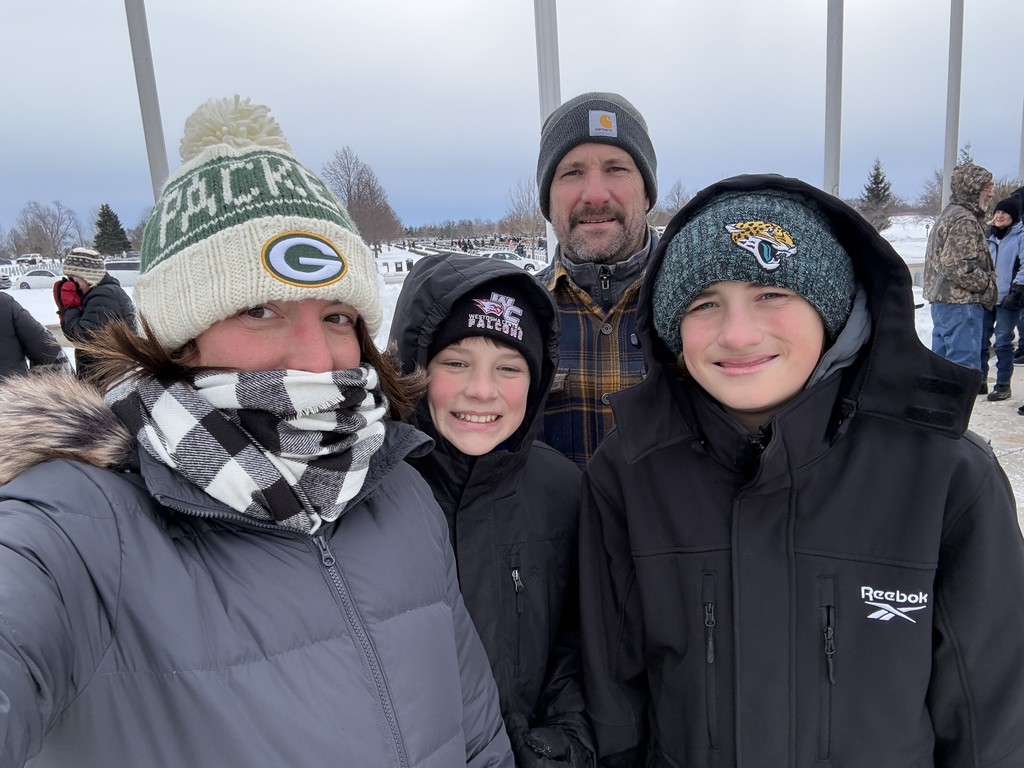 family attending wreath's across america event all bundled up for the cold day
