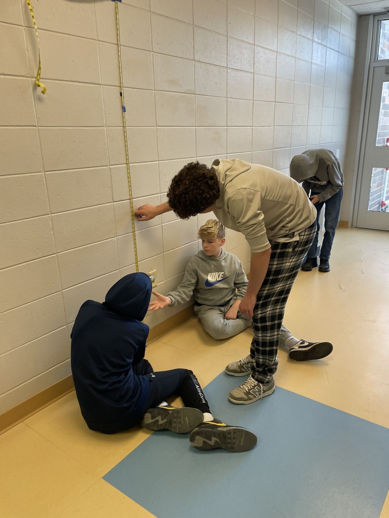 students measuring the bounce of a bouncy ball