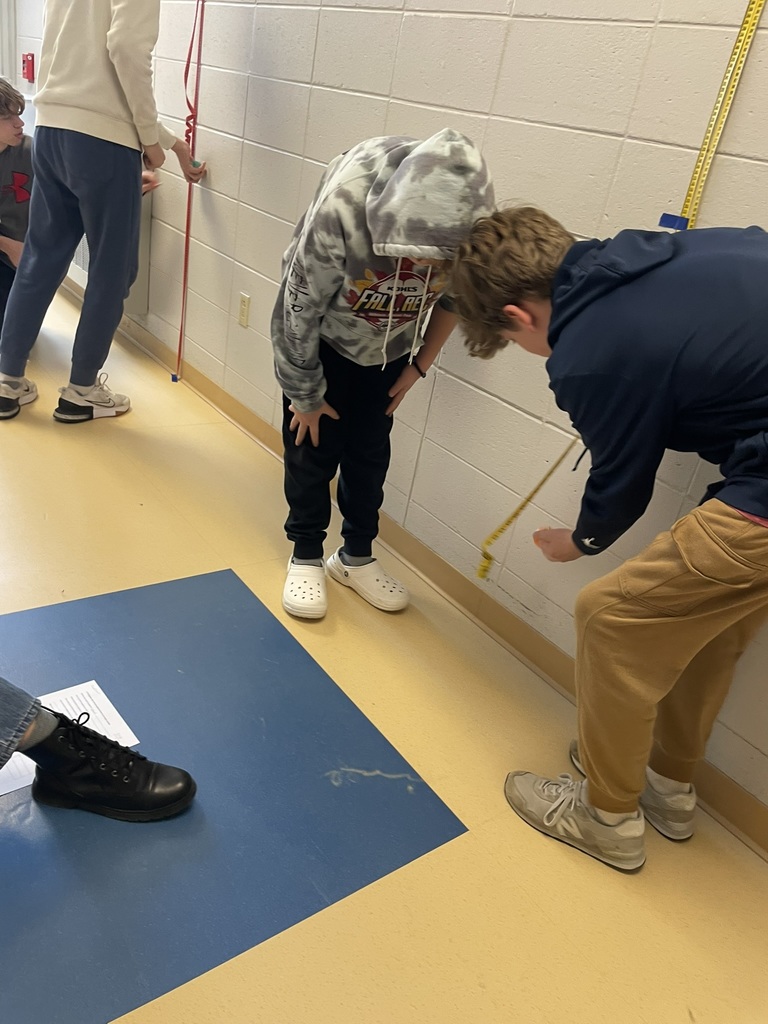 students measuring the bounce of a bouncy ball