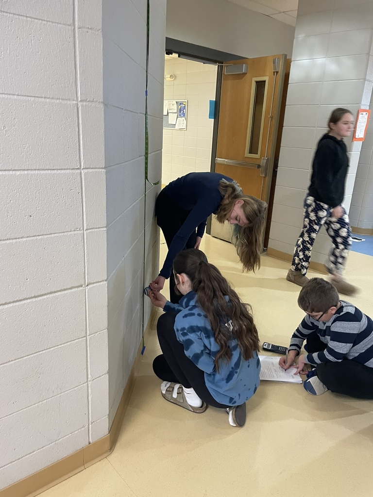 students measuring the bounce of a bouncy ball