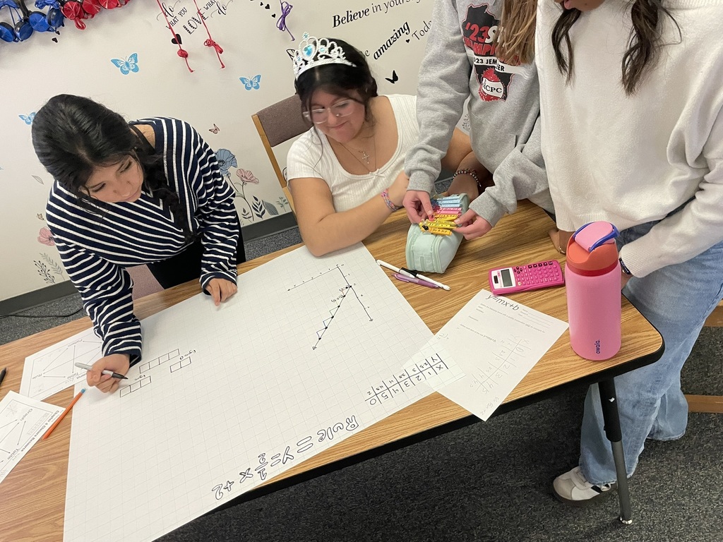 middle school students working on graphing in a math class