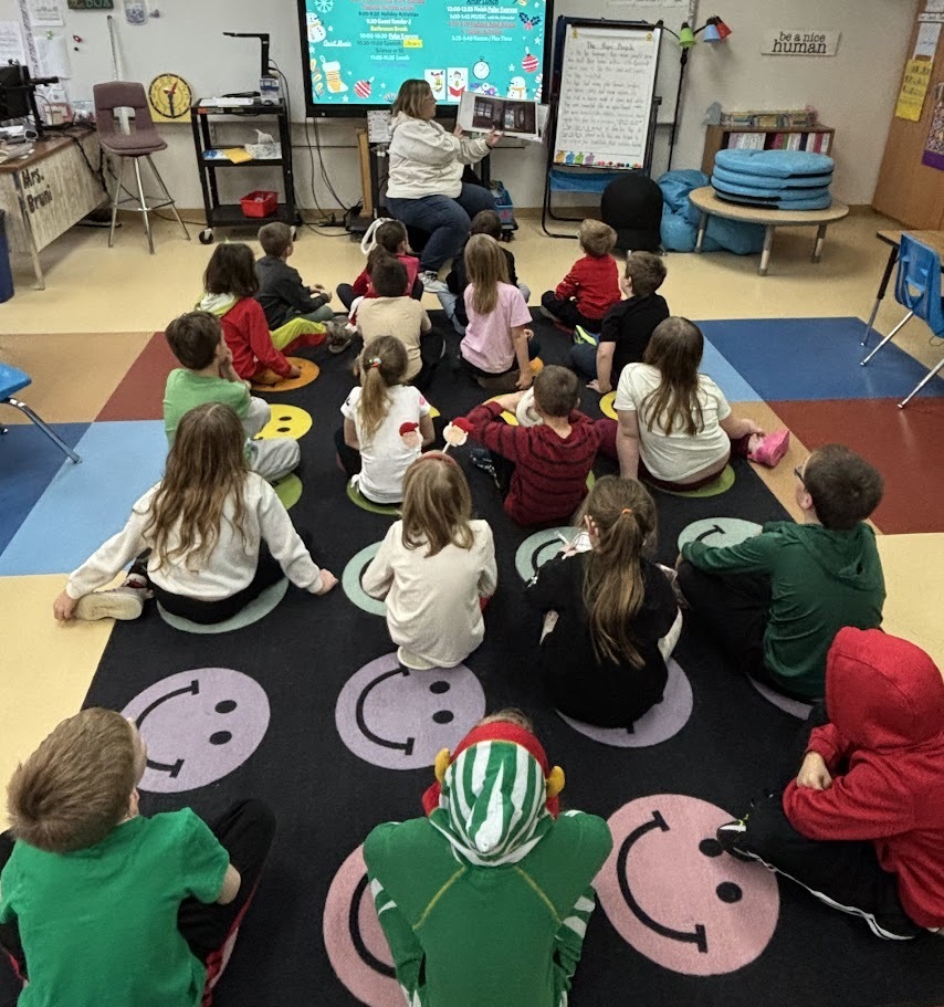 Mrs. Luengen reading to students