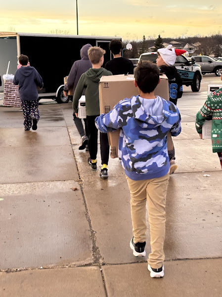students loading the RMH Toy Drive toys