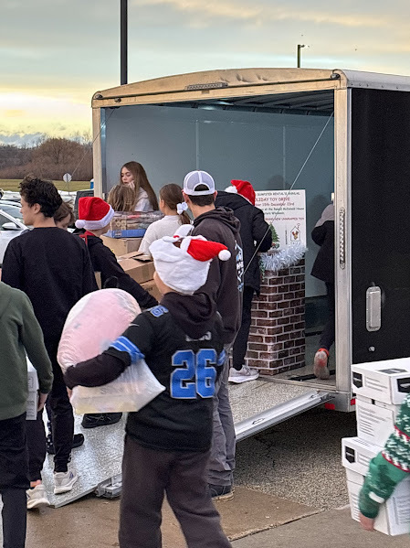 students loading the RMH Toy Drive toys