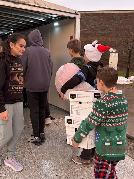 students loading the RMH Toy Drive toys