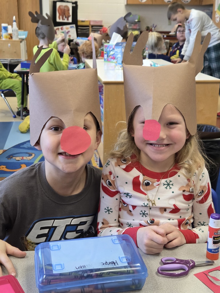 Two 3rd Grade students wearing Rudolf hats