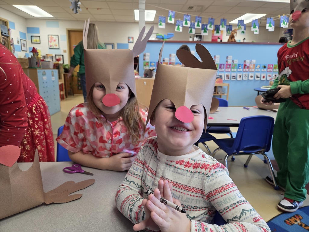 Two 3rd Grade students wearing Rudolf hats