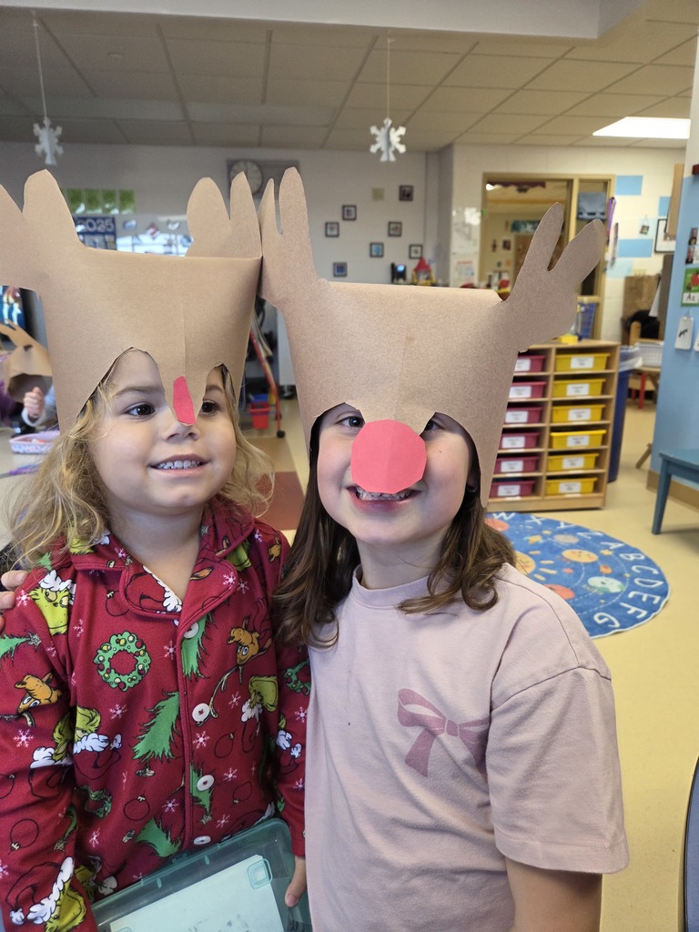 Two 3rd Grade students wearing Rudolf hats