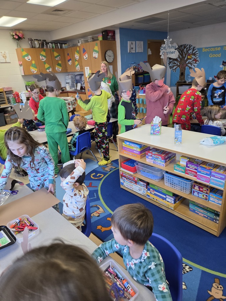 3rd grade students creating Rudolf hats