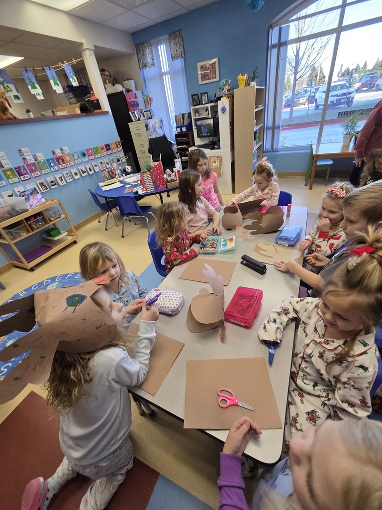 3rd grade students creating Rudolf hats