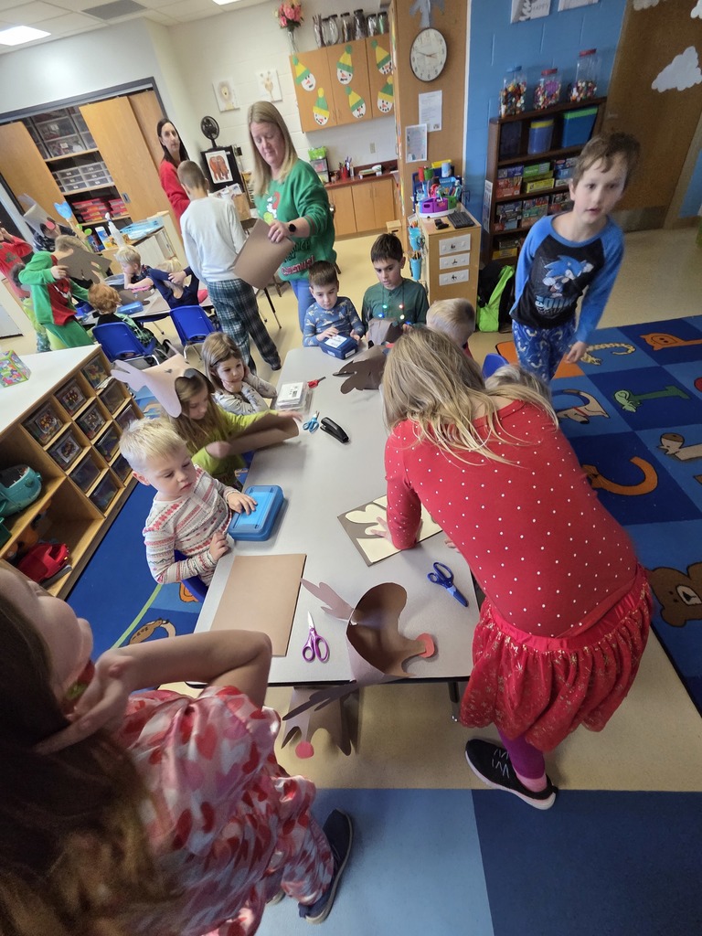 3rd grade students creating Rudolf hats