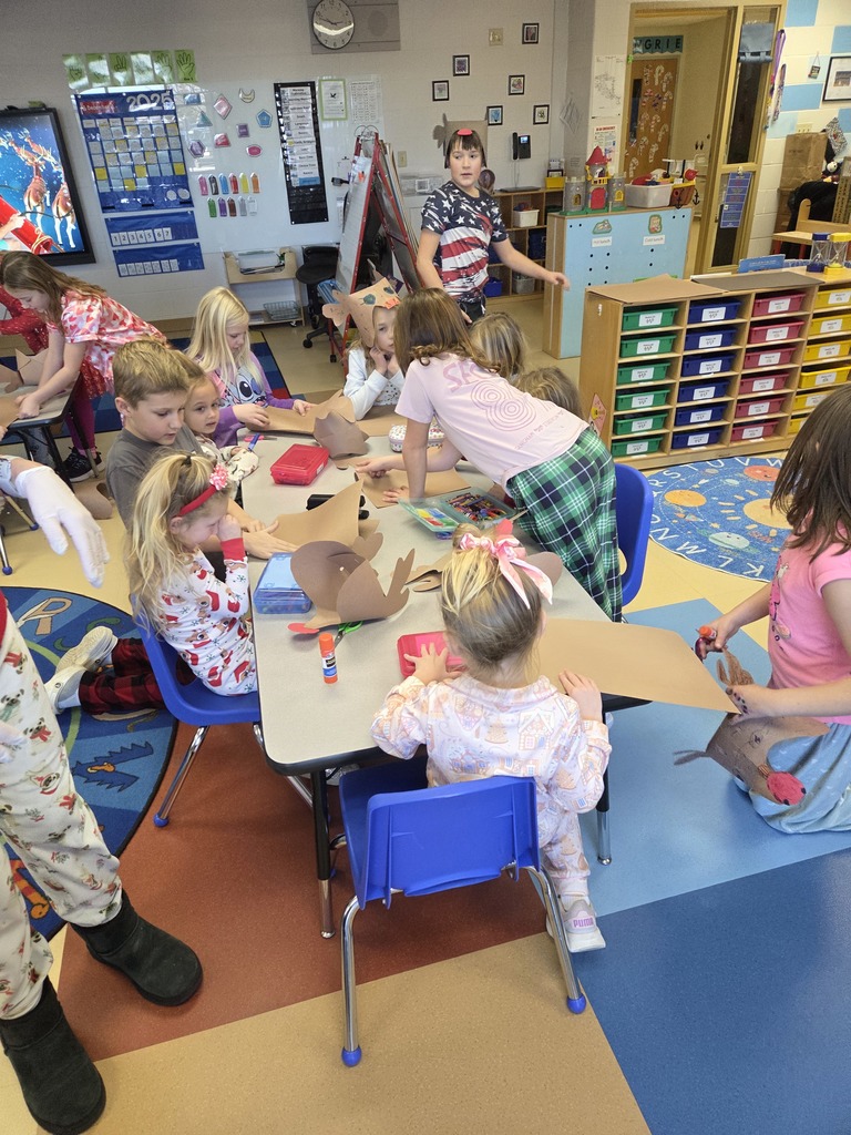 3rd grade students creating Rudolf hats