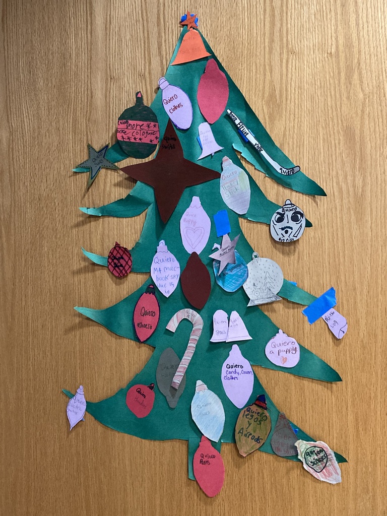 christmas trees on lockers with spanish on the ornaments created by students.