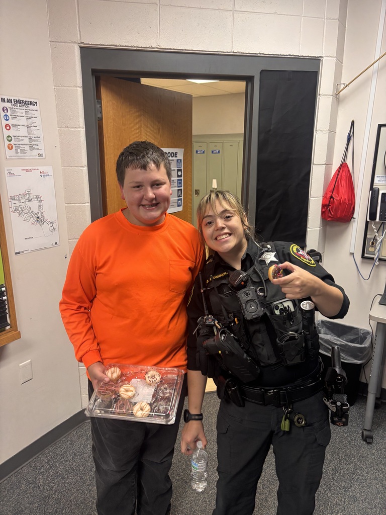 student with School Resource Office delivering a donut