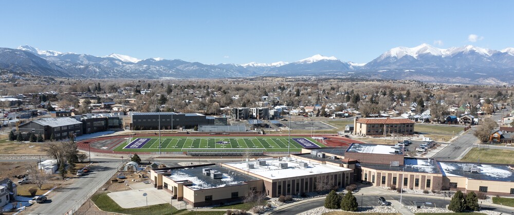 Drone view of Salida Middle and High Schools, SHS Stadium, and CMC Salida in the historic Kesner Building