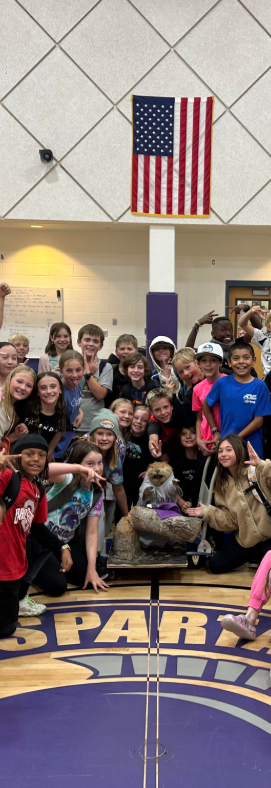 5th graders pose with Justin Beaver in SMS gym