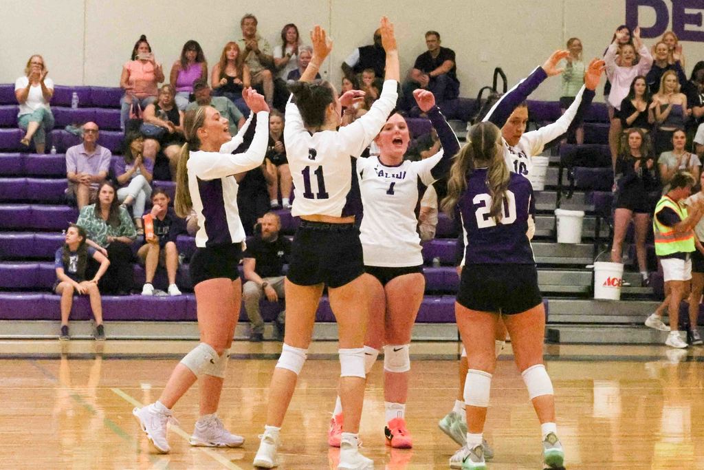 SHS Varsity Volleyball team celebrates a point during a match fall of 2025