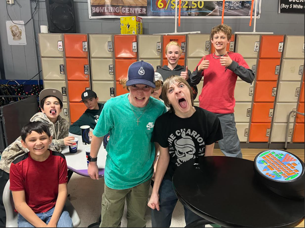 7th grade boys enjoying their bowling field trip after a day of service!