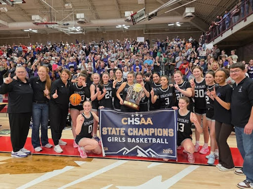 SHS Girls Basketball State Champions 2026 Team holds banner and trophy