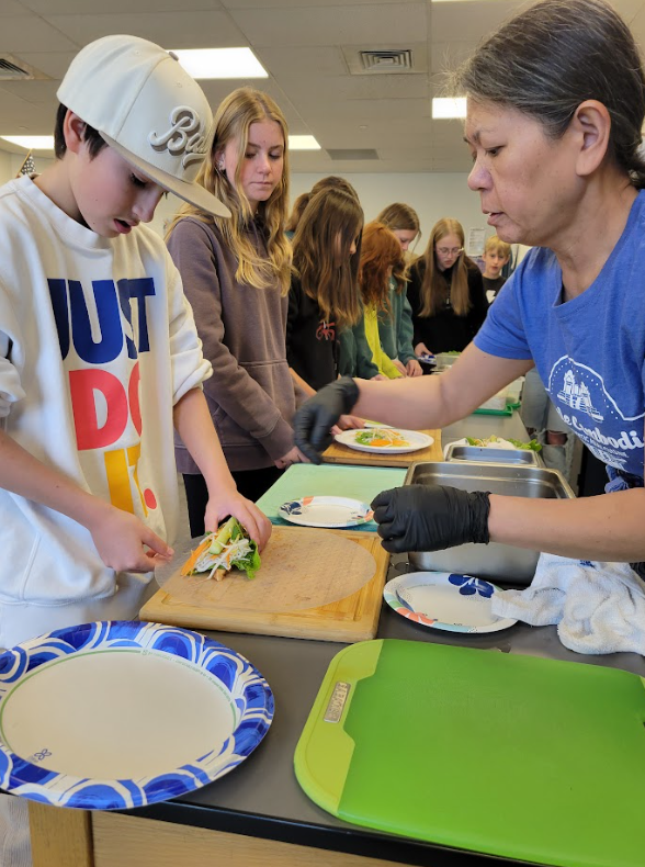 Students learning how to make spring rolls with Phanny Jones from Little Cambodia!