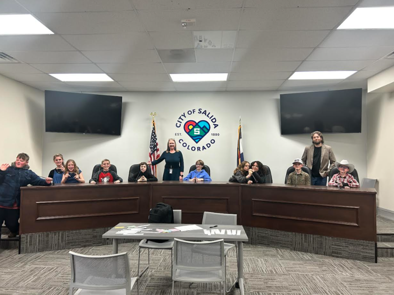 Students at City Hall sitting behind the panel!