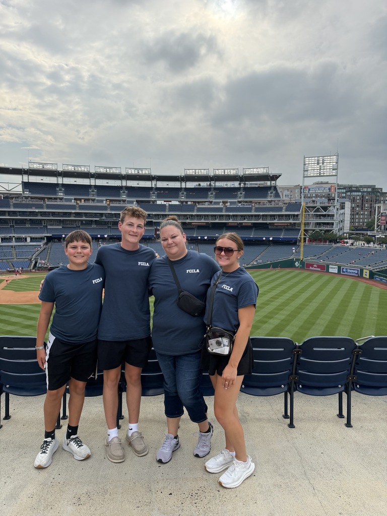 FCCLA students and advisor Mrs. Ostermann pose for a photo at Washington Nationals baseball game.