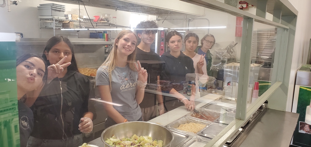 Students serving food.