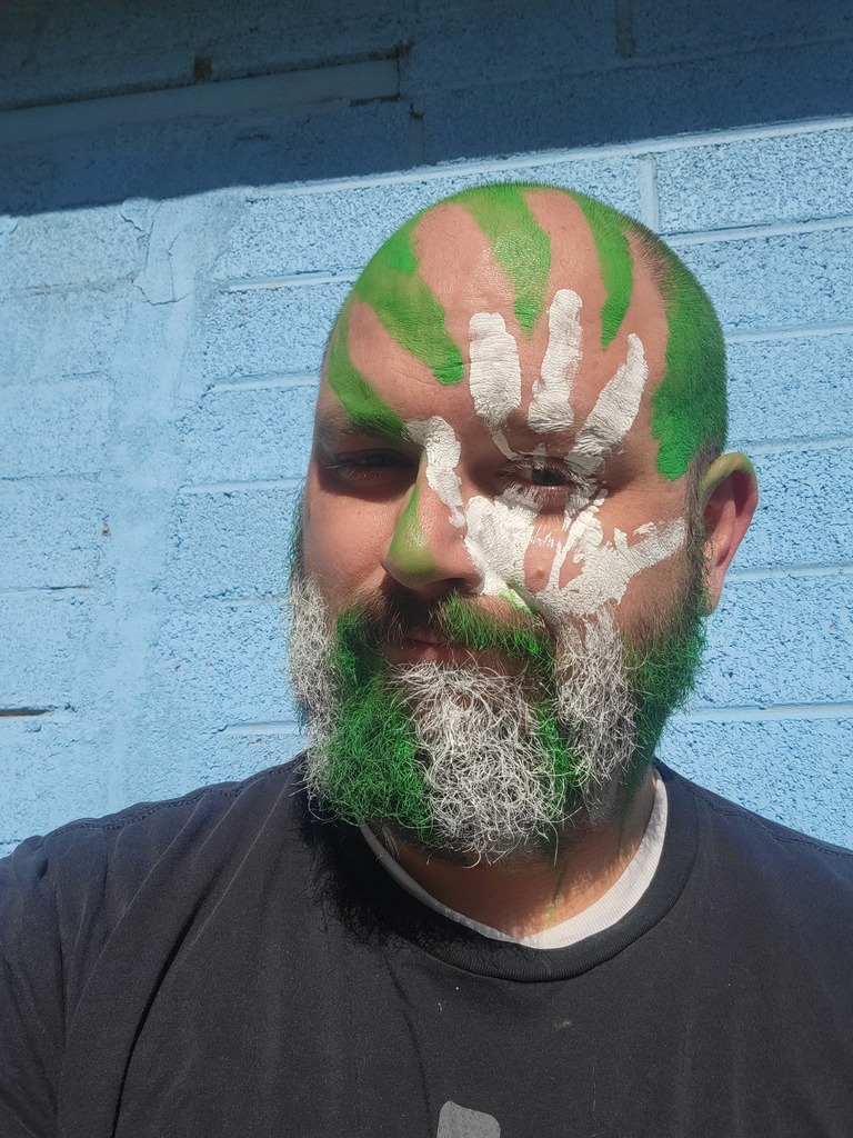 Ax Man with green and white handprints At