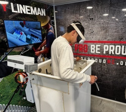 SCS student  has goggles on virtual lineman
