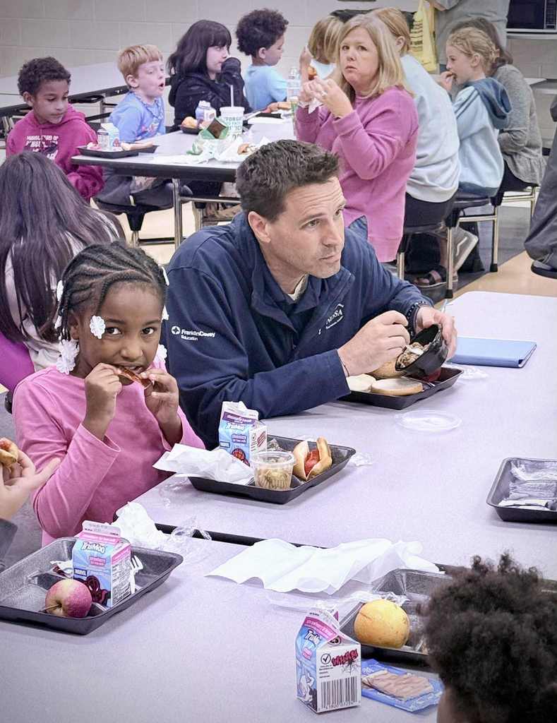 Dr. King eating lunch with students