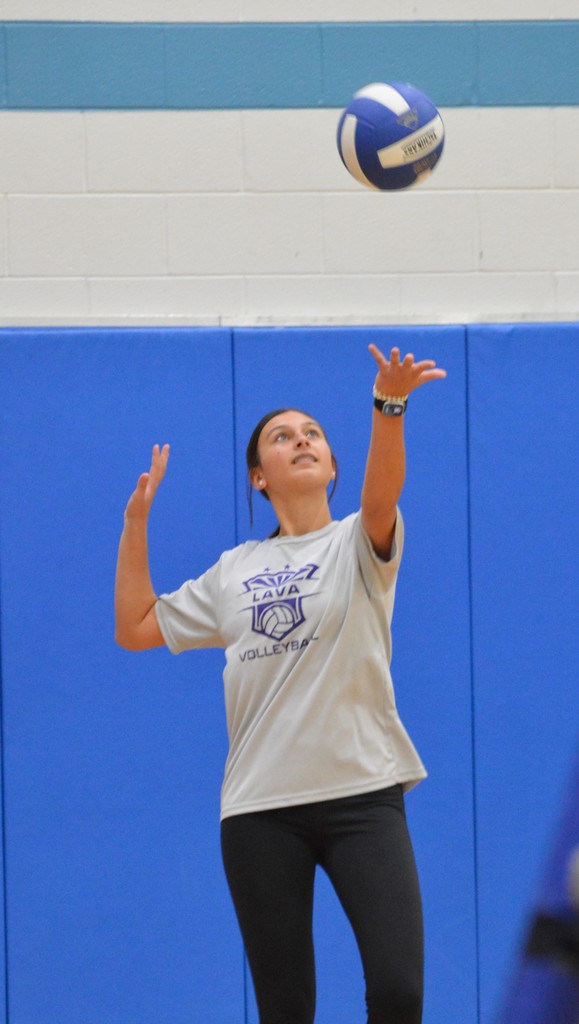 Jamison Shelton serves the volleyball in the 8th grade game.