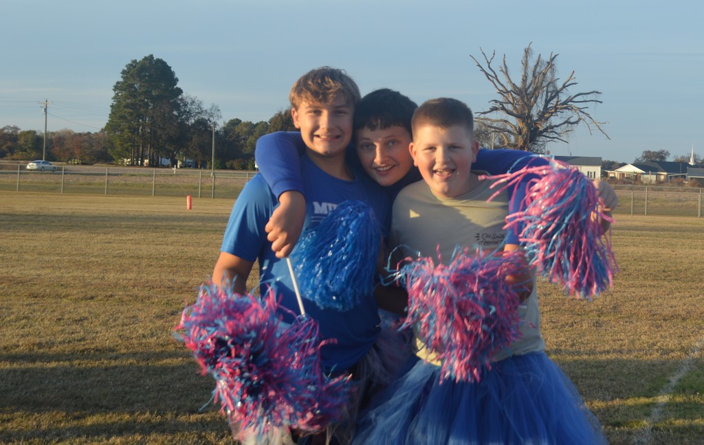 Koleden Isenhour, Adam Johnson, and Channing Jackson cheering on the teams.