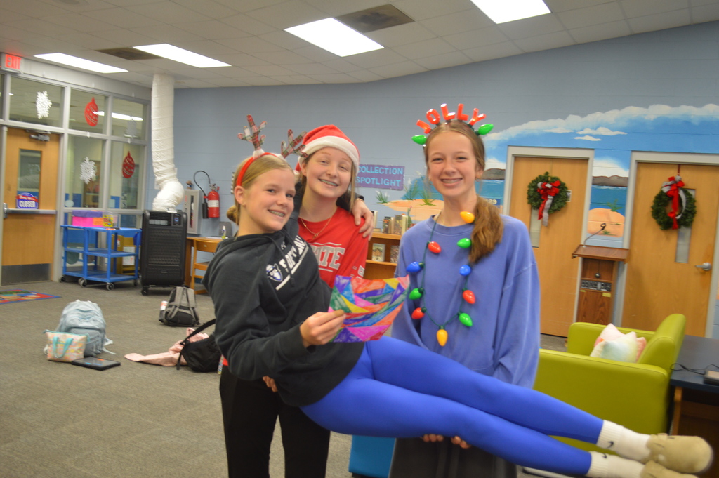 Kate Gibson, Emery Williams, and Sarah Hall sporting holiday head gear spirit!