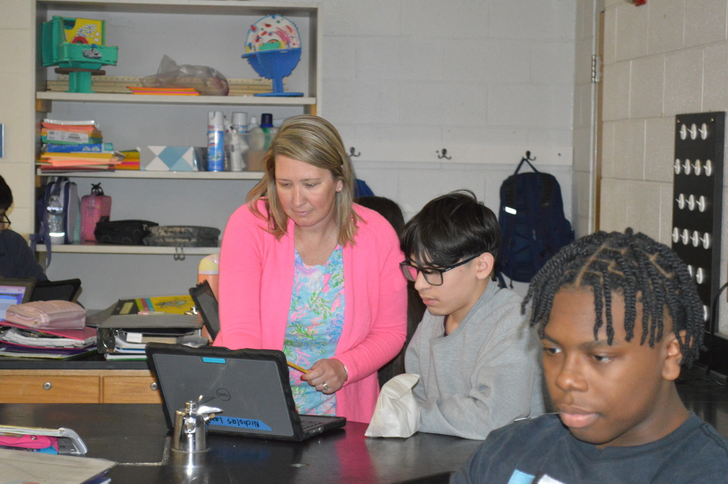 Mrs. White helping students in class!