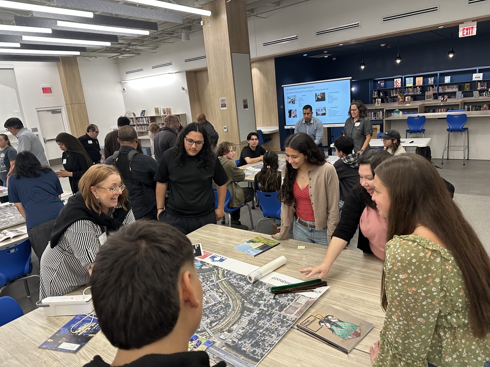 Architect students look at map