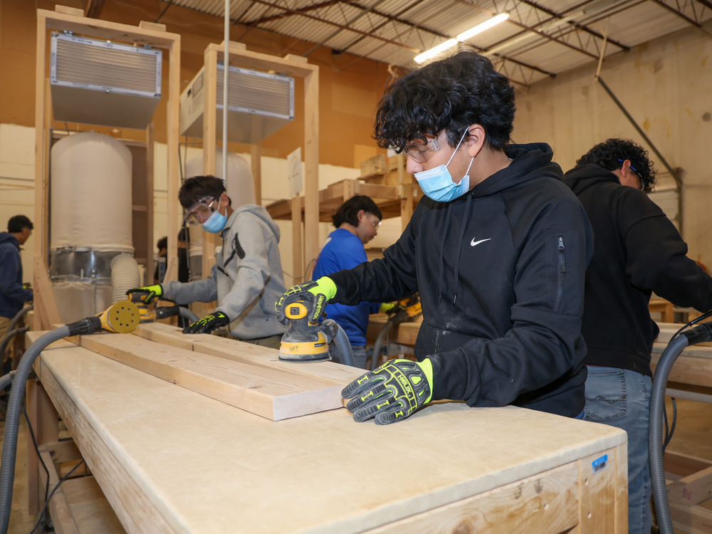Students sanding boards