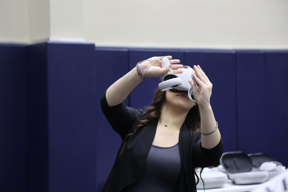 Girl operating VR goggle system