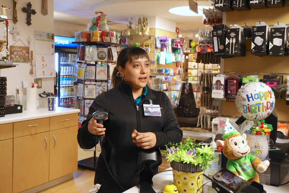 Intern works register in gift shop