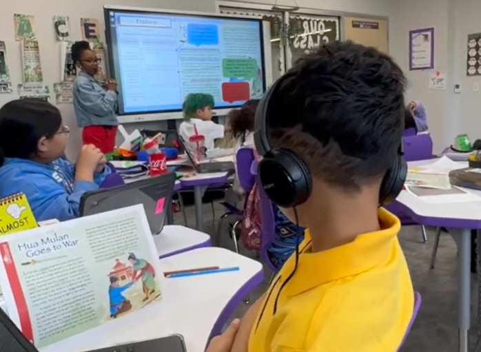 student listening to teacher