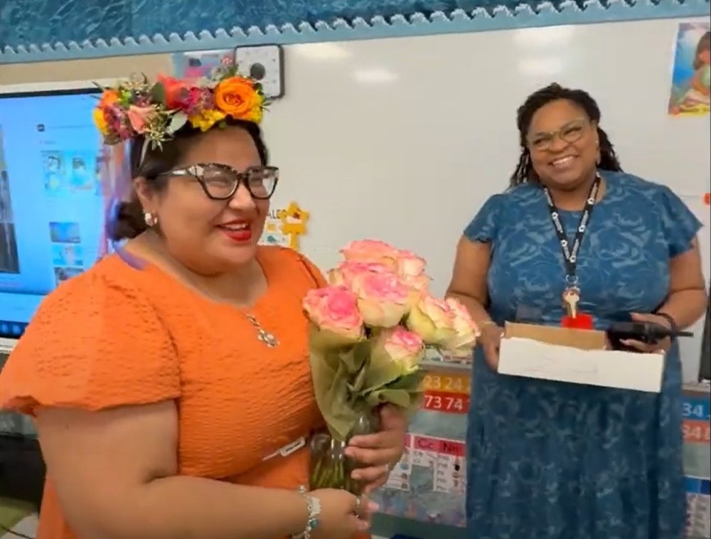 teacher receiving flowers
