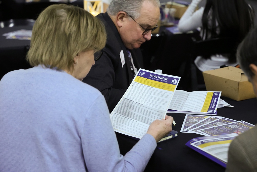 Two people look at document