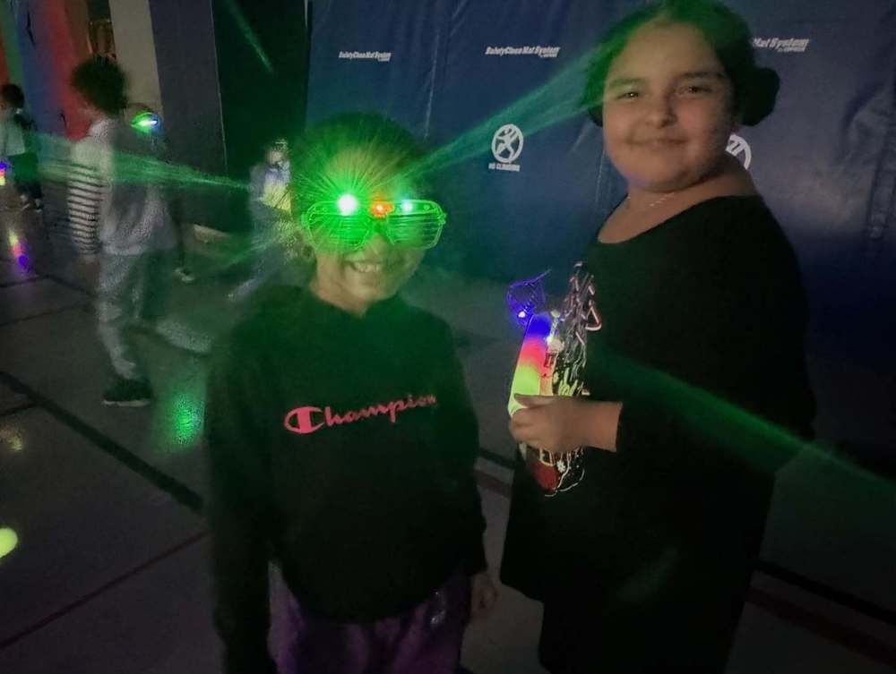 Two girls with glow sticks
