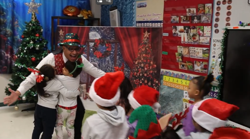 Students hugging superintendent