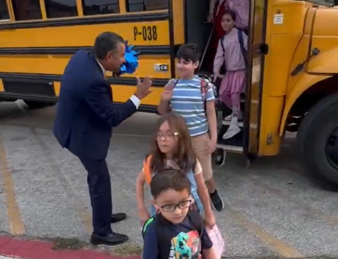 Students stepping off bus