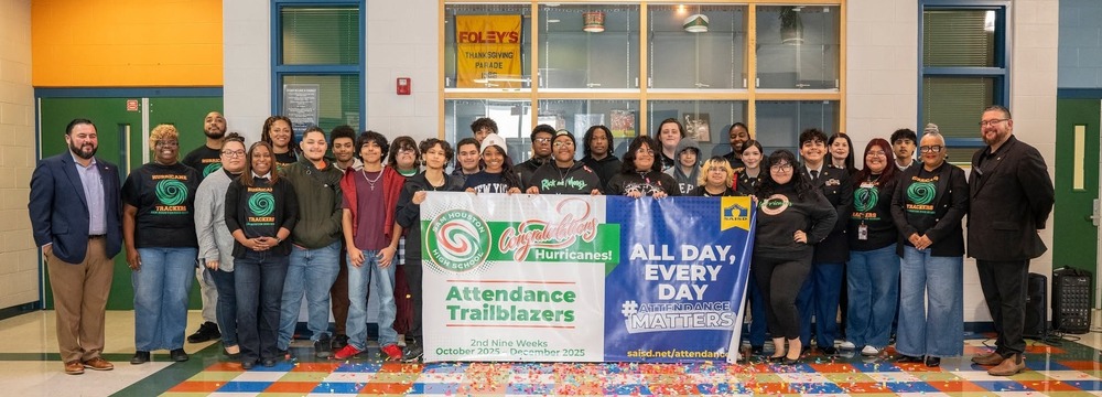 Sam Houston students and staff hold trailblazer banner