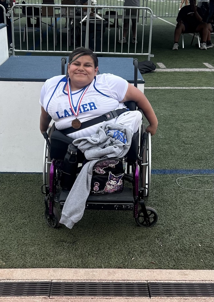 Margaret with wheelchair competition medal