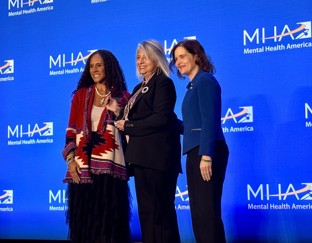 Carmen Thatcher accepts award