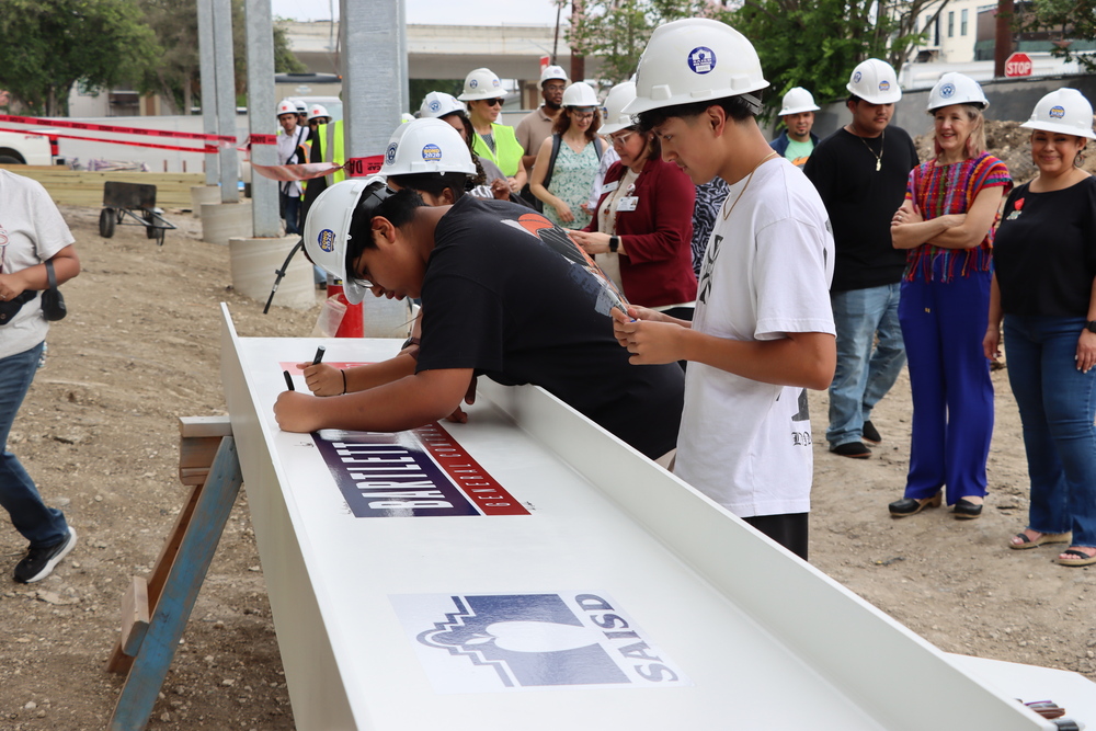 Students sign beam at Fox Tech