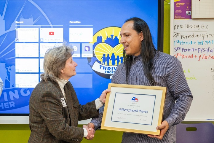 Teacher receives award while state senator applauds