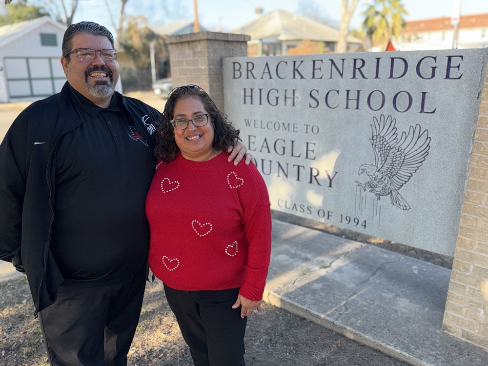 Man and woman in front of Brackenridge Sign